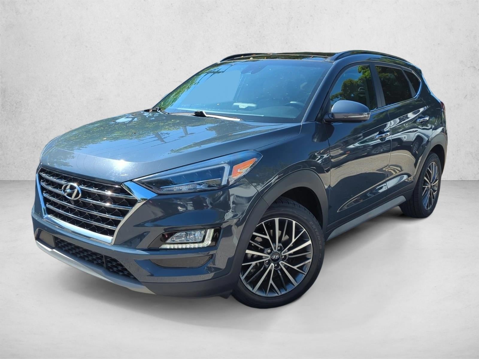 2021 Hyundai TUCSON Ultimate FWD in Dusk Blue — front three-quarter view